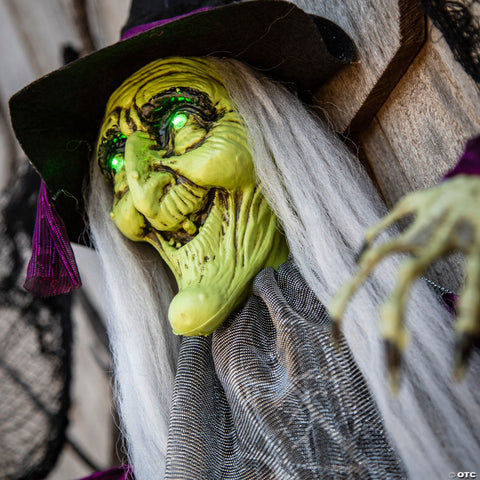 4 Ft. Hanging Animated Witch with Green Eyes Halloween Decoration